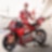 Ducati Corse team leaning on Ducati Motorbike.